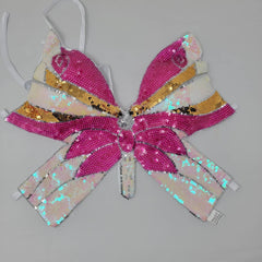 Haut rose à paillettes papillon des années 2000